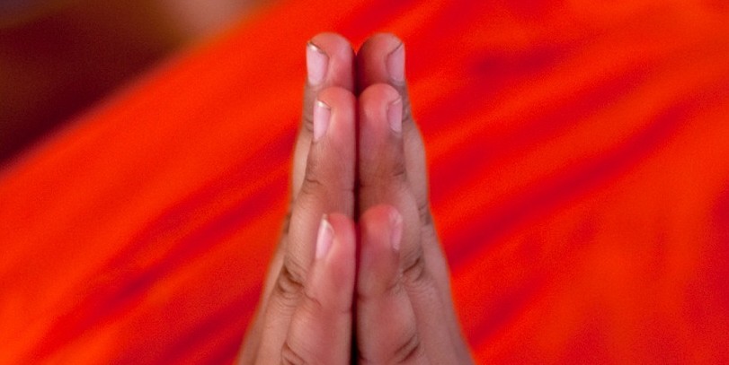 Praying_monk_-_Laos_1